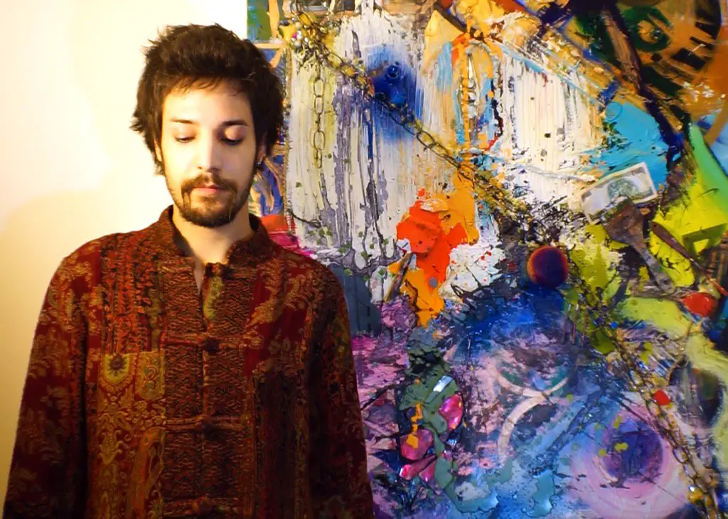 the artist Zander pictured with his work, Waterfall